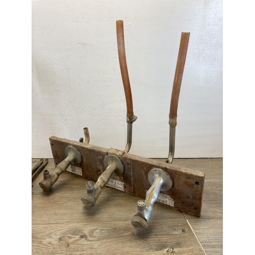 448 - Four pieces of breweriana to include Gaskell & Chambers Dalex brass beer pumps, two dated 1963 and o... 