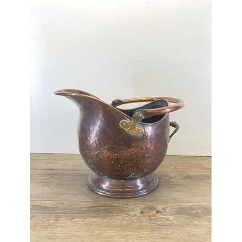 451 - A Victorian copper helmet coal scuttle - approx. 34cm high