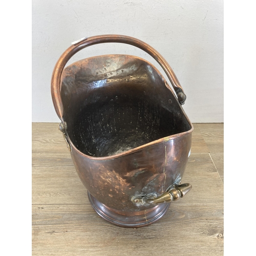 451 - A Victorian copper helmet coal scuttle - approx. 34cm high