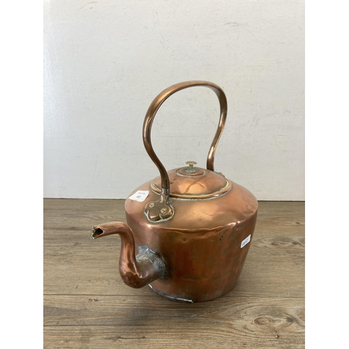 452 - A Victorian copper kettle - approx. 32cm high