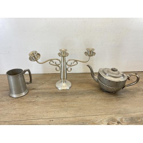 456 - A collection of metalware to include P. H. V & Co. EPNS cocktail shaker, pewter three branch candela... 