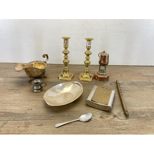 461 - A collection of metalware to include Oriental brass bowl, candlesticks, miniature miner’s lamp, hip ... 