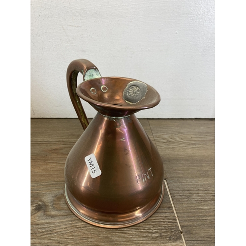 462 - Ten pieces of 19th century graduating copperware, seven jugs stamped HR and three colanders