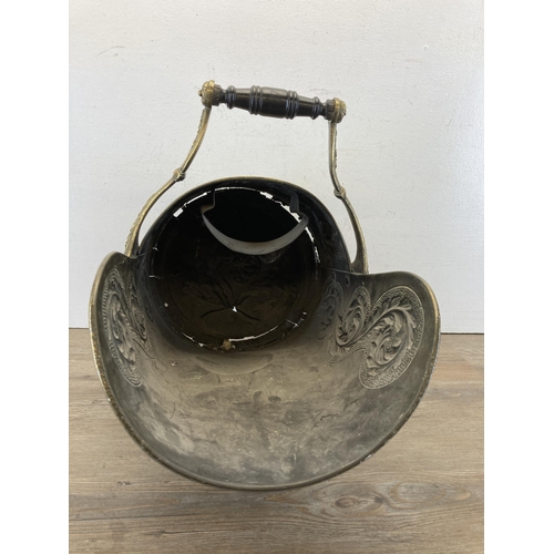 464 - A Victorian embossed brass coal scuttle with ebonised handle - approx. 43cm high x 45cm long