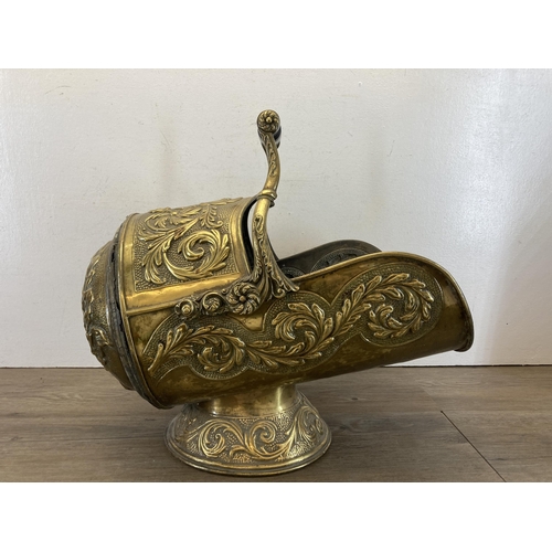 464 - A Victorian embossed brass coal scuttle with ebonised handle - approx. 43cm high x 45cm long