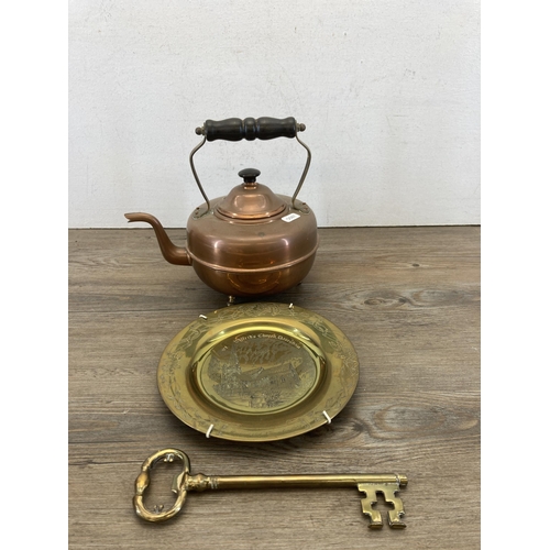 482 - A collection of metalware to include Victorian William Soutter & Sons copper kettle, brass trivet st... 