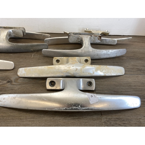 485A - Ten mid 20th century Dryad aluminium door handles together with a brass wall hanging bell