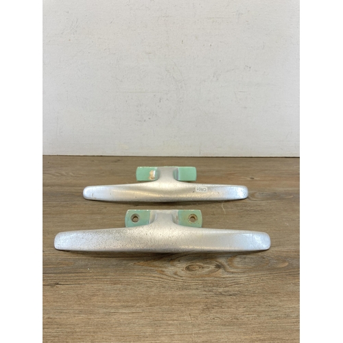 485A - Ten mid 20th century Dryad aluminium door handles together with a brass wall hanging bell