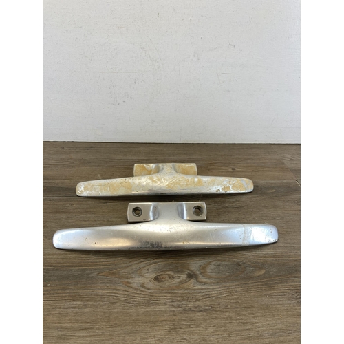 485A - Ten mid 20th century Dryad aluminium door handles together with a brass wall hanging bell