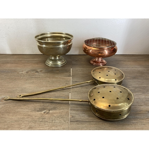 493 - A collection of metalware to include brass chamberstick, copper bowl, brass barley twist table lamp ... 