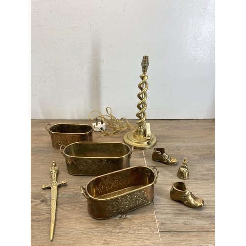 493 - A collection of metalware to include brass chamberstick, copper bowl, brass barley twist table lamp ... 