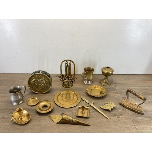 493 - A collection of metalware to include brass chamberstick, copper bowl, brass barley twist table lamp ... 