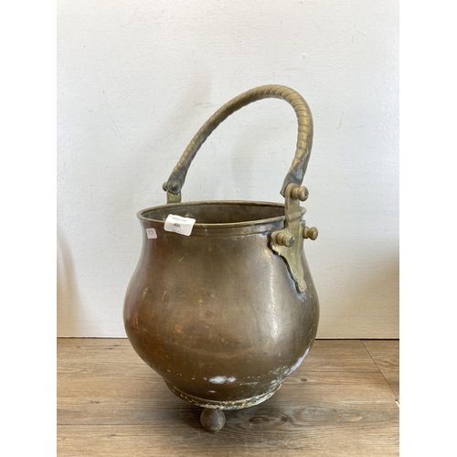 496 - Four pieces of copper and brassware to include jug, coal scuttle, coal bucket etc.