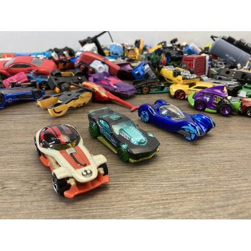 509 - A box containing various die-cast model vehicles to include Corgi, Zuru Metal Machines, Hot Wheels e... 