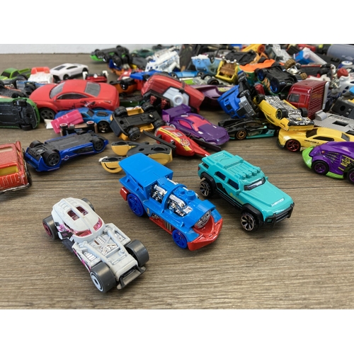 509 - A box containing various die-cast model vehicles to include Corgi, Zuru Metal Machines, Hot Wheels e... 