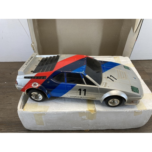 513 - A boxed K. K. Matsushiro Tokyo Japan Super Radio Tron 1/11 scale BMW M1 G-4 remote control model veh... 