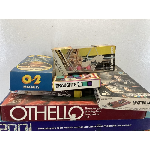 514 - A collection of vintage board games to include Cluedo, Othello, Mastermind etc.