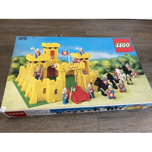 515 - A collection of 1970s Lego construction sets and accessories to include 375 Yellow Castle, 182 Train... 