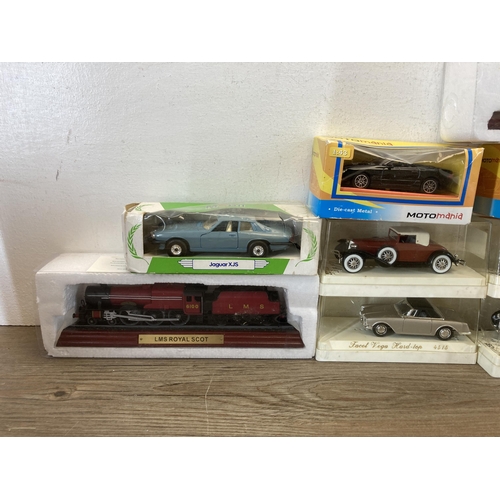 526 - A collection of boxed model locomotives and die-cast vehicles to include Solido, Corgi etc.