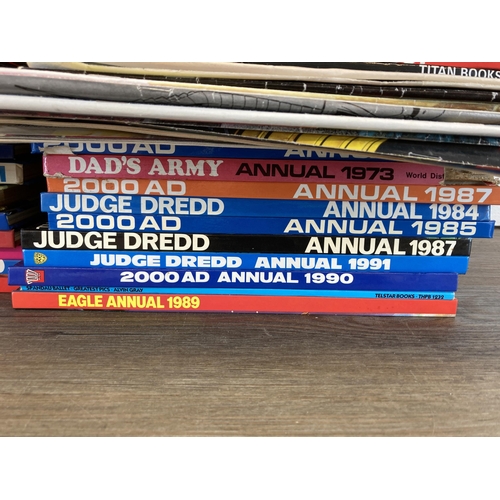 581 - A large collection of 2000 AD and Judge Dredd annuals, comics and magazines to include 2000 AD Octob... 