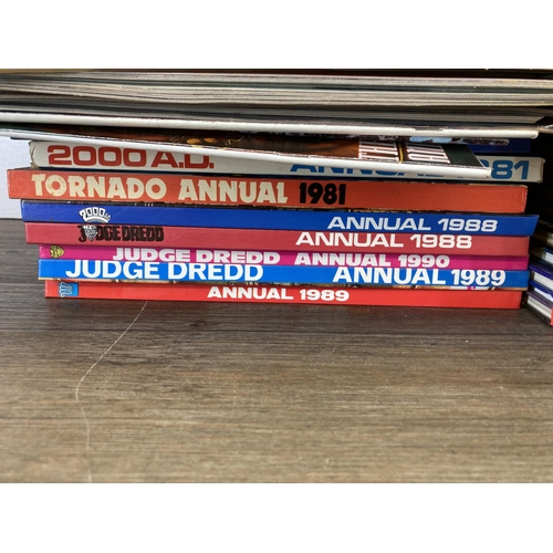 581 - A large collection of 2000 AD and Judge Dredd annuals, comics and magazines to include 2000 AD Octob... 