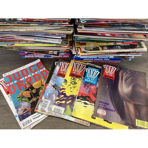 581 - A large collection of 2000 AD and Judge Dredd annuals, comics and magazines to include 2000 AD Octob... 