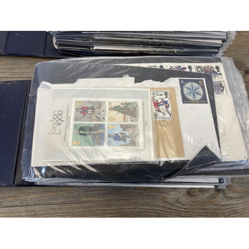 593 - Two Stuart albums containing First Day Covers