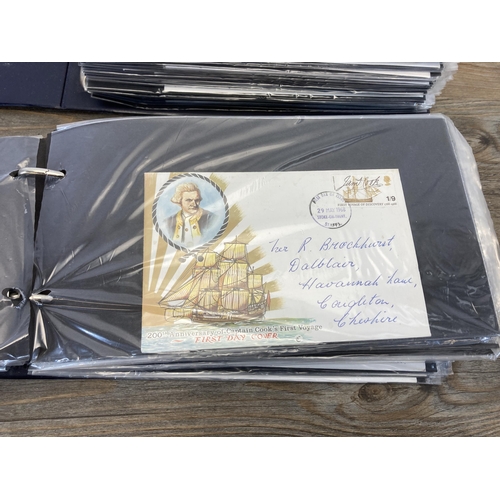 593 - Two Stuart albums containing First Day Covers