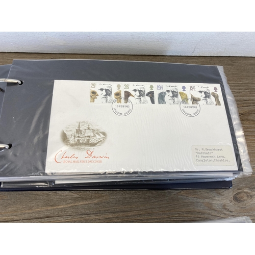 593 - Two Stuart albums containing First Day Covers