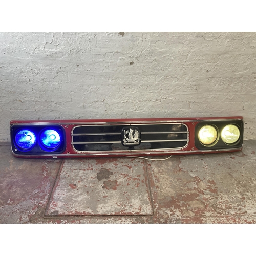 594 - A Bedford front grille with converted LED lights - approx. 33cm high x 212cm wide