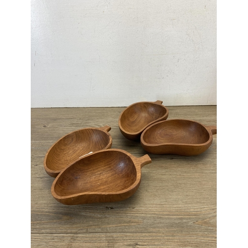 595 - A collection of treenware to include carved teak leaf shaped bowls, animal figurines etc.