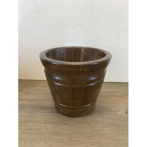 599 - Three oak jardinières - largest approx. 25cm high x 28cm diameter