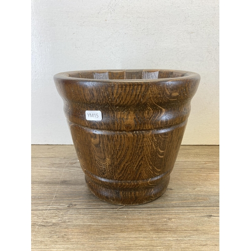 599 - Three oak jardinières - largest approx. 25cm high x 28cm diameter