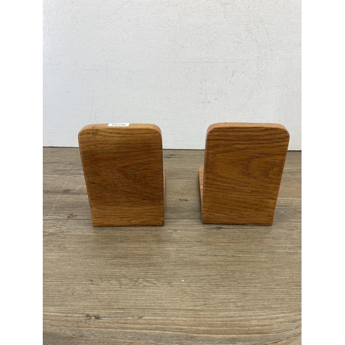 601 - A pair of oak and cast metal Jaguar mascot bookends - approx. 14cm high x 10cm wide x 15cm long