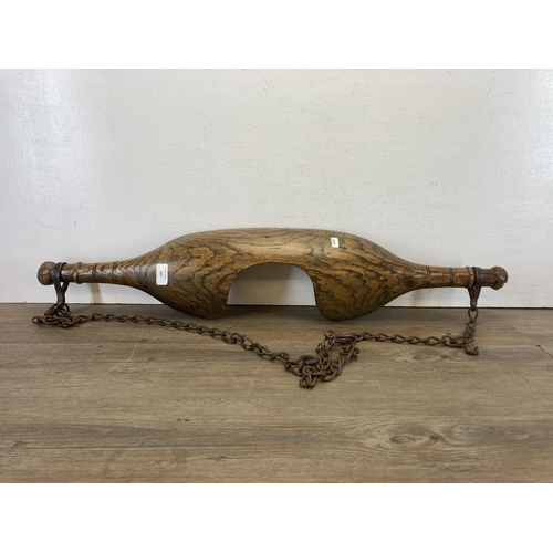 603 - A 19th century carved elm shoulder yoke - approx. 87cm wide