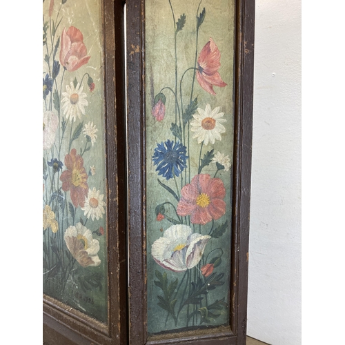 607 - An early 20th century hand painted oak three section folding fire screen - approx. 26cm high x 65cm ... 