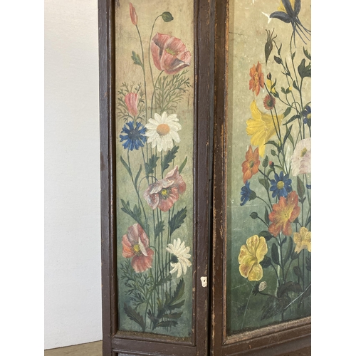 607 - An early 20th century hand painted oak three section folding fire screen - approx. 26cm high x 65cm ... 