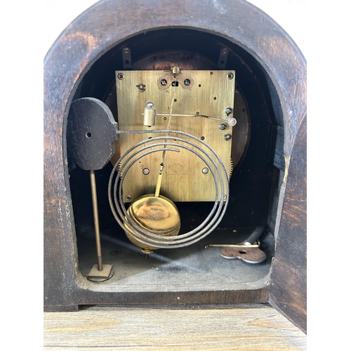 639 - A 1930s Empire oak cased chiming mantel clock with pendulum and key - approx. 21cm high