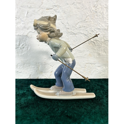 310 - A Lladro Sport Billy Productions Skier figurine - approx. 21cm high