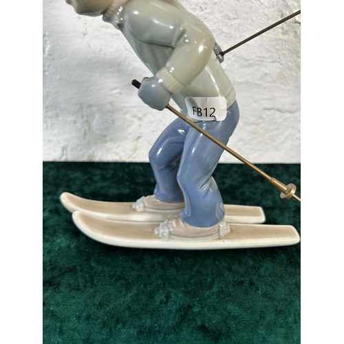 310 - A Lladro Sport Billy Productions Skier figurine - approx. 21cm high