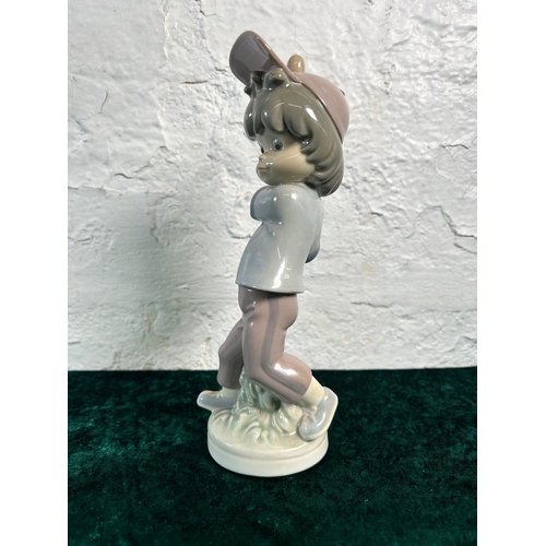 311 - A Lladro Sport Billy Productions Baseball Player figurine - approx. 24cm high