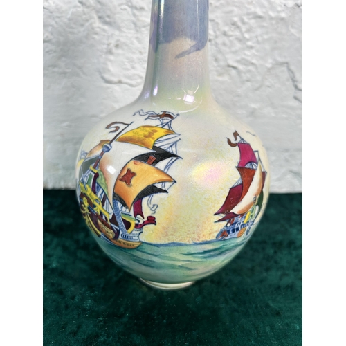 319 - A Coronet England lusterware ship scene bottle neck vase - approx. 23cm high