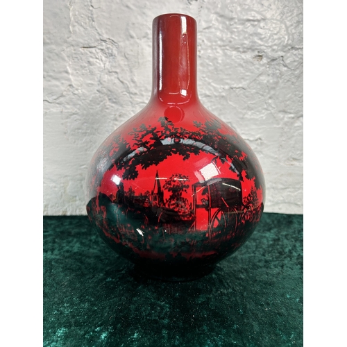 321 - A Royal Doulton Flambé Woodcut no. 1618 bottle neck vase - approx. 24cm high