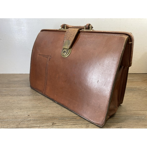 640C - Three antique and vintage bags and cases to include brown leather Gladstone bag etc.