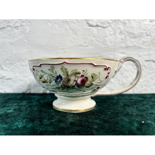 351 - A 19th century hand painted porcelain cup and saucer, signed and stamped to base