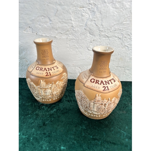 356 - A pair of Royal Doulton Grant's whisky advertising decanters/vases - approx. 18cm high