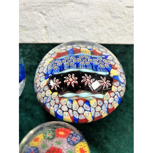 360 - Four art glass paperweights to include Millefiori etc.