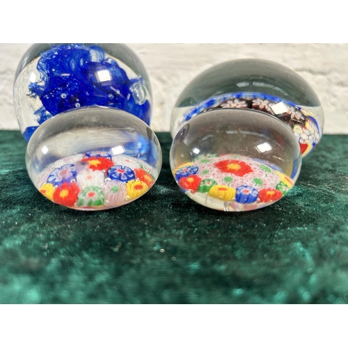 360 - Four art glass paperweights to include Millefiori etc.