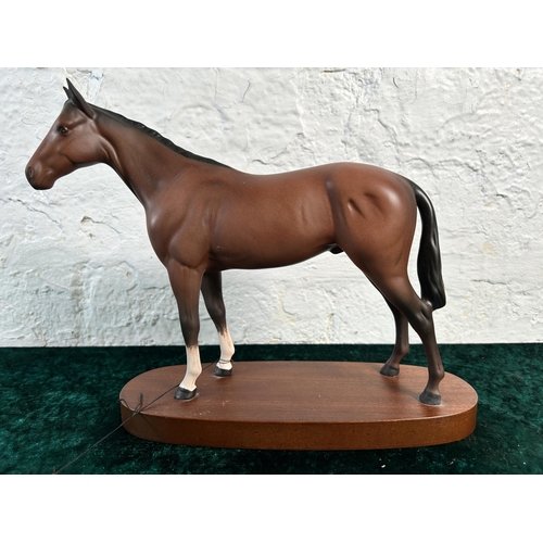 368 - A Royal Doulton matt brown horse figurine on mahogany plinth - approx. 22cm high x 28cm long