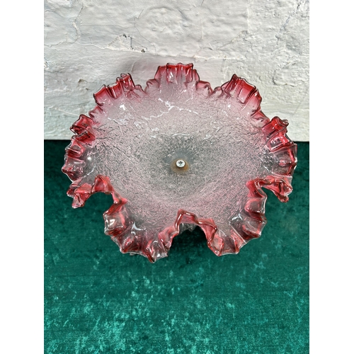 372 - A Victorian style cranberry glass and cast metal pedestal dish - approx. 27cm high x 22cm diameter